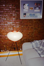 The Akari Moon Jar - Lucy’s Lamps is a modern paper lantern floor lamp with a soft glow, perfect as a minimalist lamp or aesthetic lamp. Functions as a light therapy lamp, LED floor lamp, tripod floor lamp, or bedside lamp for modern lamp for bedroom or floor lamps for living room.