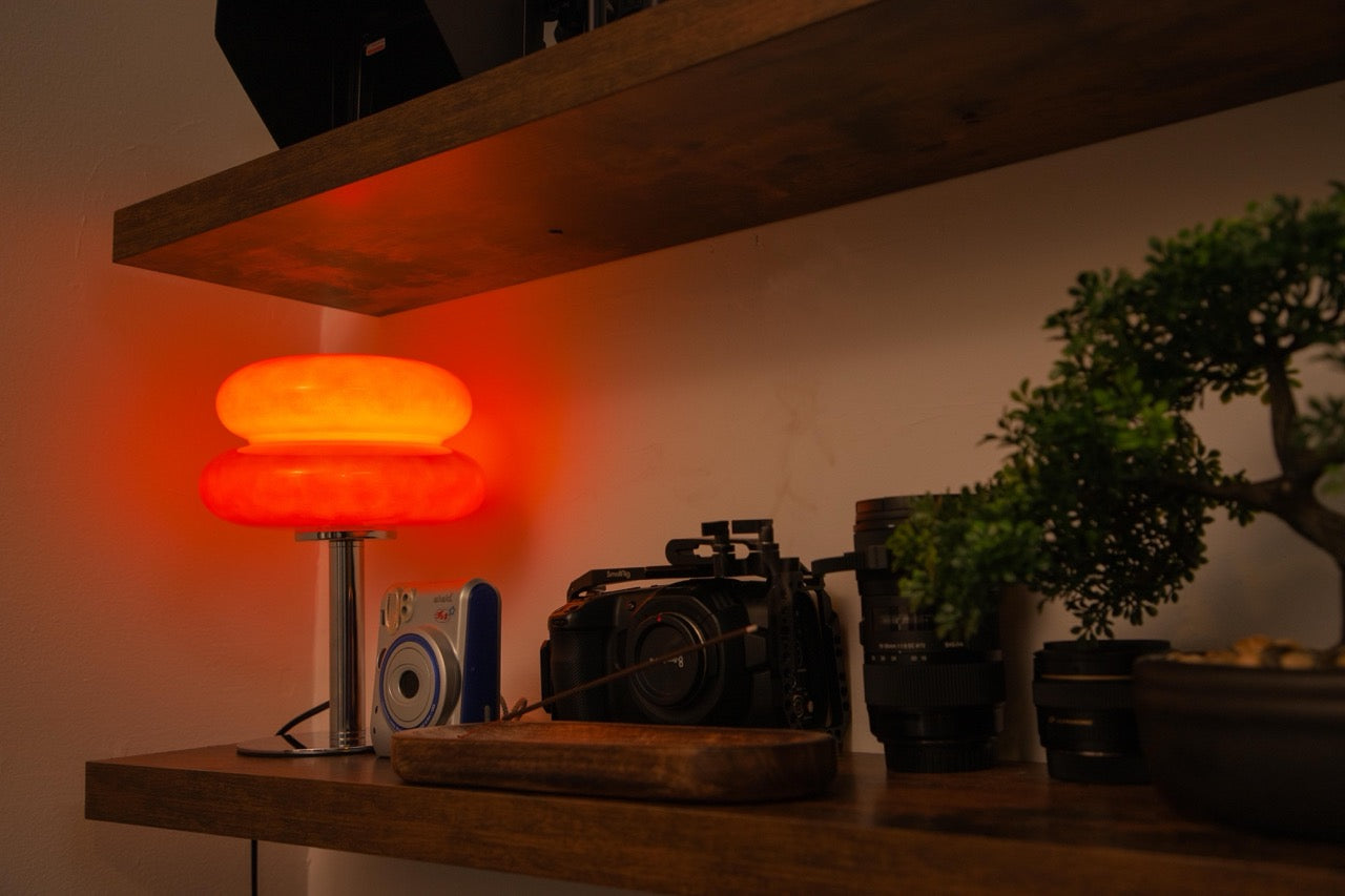 The Capella - Lucy’s Lamps retro stained glass orange table lamp serves as a modern table lamp for bedroom or living room. This small desk lamp is perfect as a bedside table lamp, side table lamp, light therapy lamp, and aesthetic lamp for minimalist spaces. Explore Lucys Lamps for more home lighting ideas.