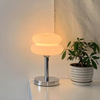 The Capella - Lucy’s Lamps retro stained glass lamp serves as a modern table lamp for bedroom or living room. This small desk lamp is perfect as a bedside table lamp, side table lamp, light therapy lamp, and aesthetic lamp for minimalist spaces. Explore Lucys Lamps for more home lighting ideas.