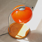 The Solange - Lucy’s Lamps is a modern orange glass table lamp with candle warmer lamp functionality. Aesthetic retro stained glass lamp ideal as a bedside table lamp, small desk lamp, or minimalist side table lamp. Perfect for bedroom table lamps or modern lamp for living room styling. Explore Lucys Lamps for more home lighting ideas.
