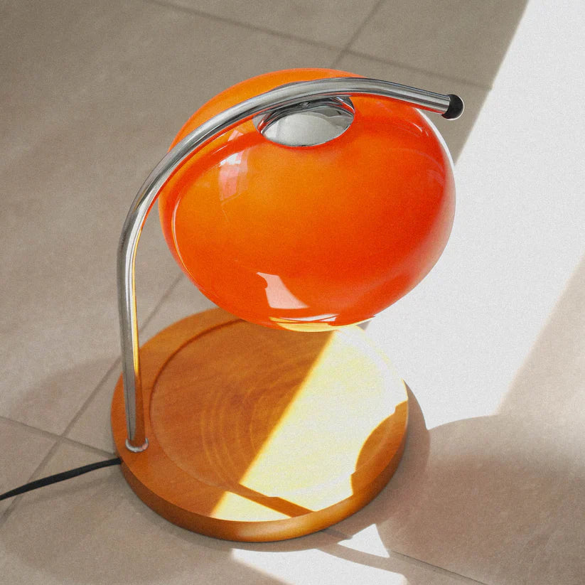 The Solange - Lucy’s Lamps is a modern orange glass table lamp with candle warmer lamp functionality. Aesthetic retro stained glass lamp ideal as a bedside table lamp, small desk lamp, or minimalist side table lamp. Perfect for bedroom table lamps or modern lamp for living room styling. Explore Lucys Lamps for more home lighting ideas.